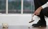 Man putting golf ball