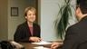 Woman discussing a transfer with her boss.